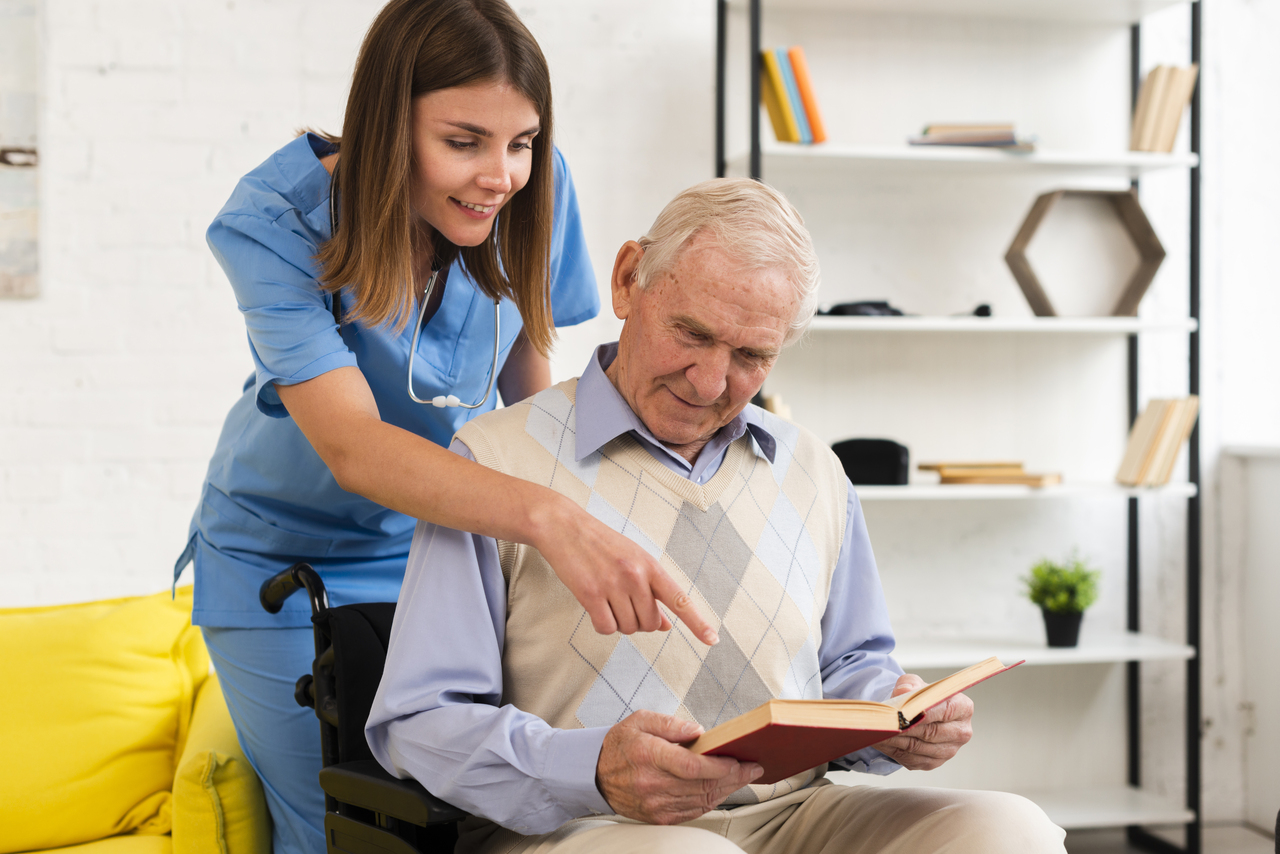 nurse-pointing-old-man-s-book (1)
